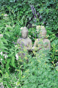 Buddhist statues can be found throughout the garden.