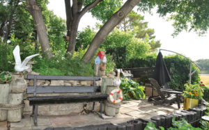 A retaining wall overlooking the river complete with a nautical theme.