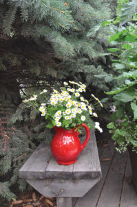 Debbie loves to add unexpected vases full of flowers.